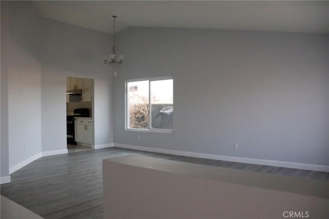 unfurnished room with high vaulted ceiling, dark wood-type flooring, and a notable chandelier