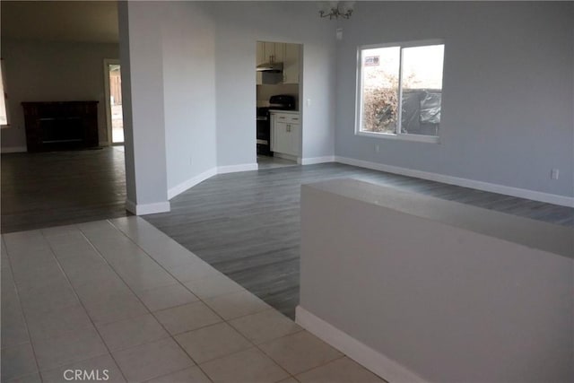 interior space with tile patterned flooring and a fireplace