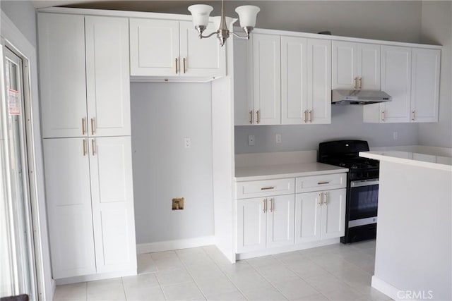 kitchen with white cabinets, gas stove, decorative light fixtures, a notable chandelier, and light tile patterned floors