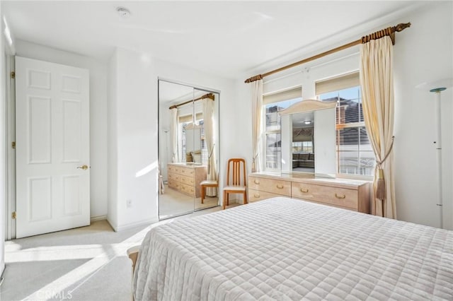 carpeted bedroom with a closet