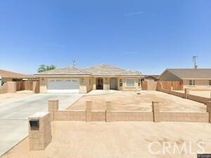 ranch-style home featuring a garage