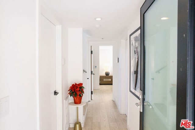 hallway featuring light hardwood / wood-style flooring