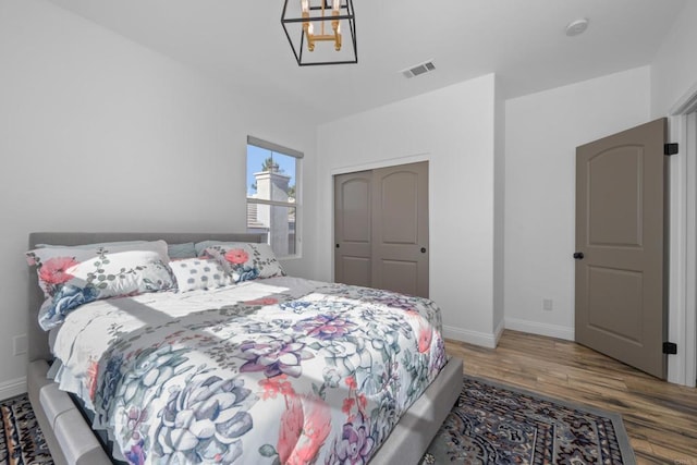 bedroom featuring a closet and hardwood / wood-style floors