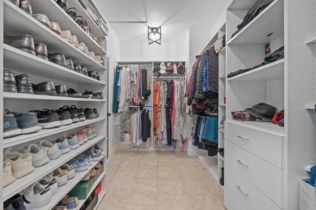 walk in closet featuring light tile patterned floors