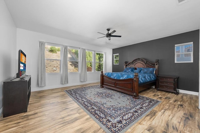 bedroom featuring ceiling fan and hardwood / wood-style flooring