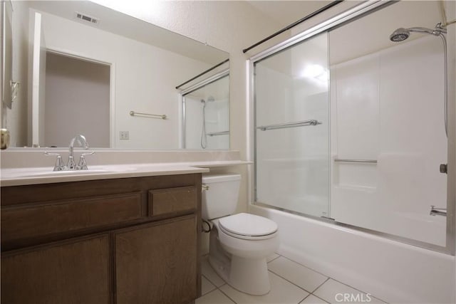 full bathroom with toilet, tile patterned floors, vanity, and shower / bath combination with glass door