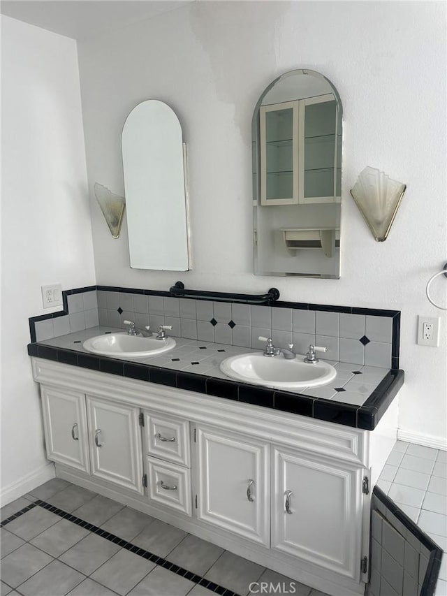 bathroom featuring tile patterned floors and vanity