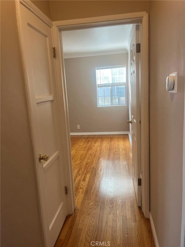 hall with light hardwood / wood-style floors