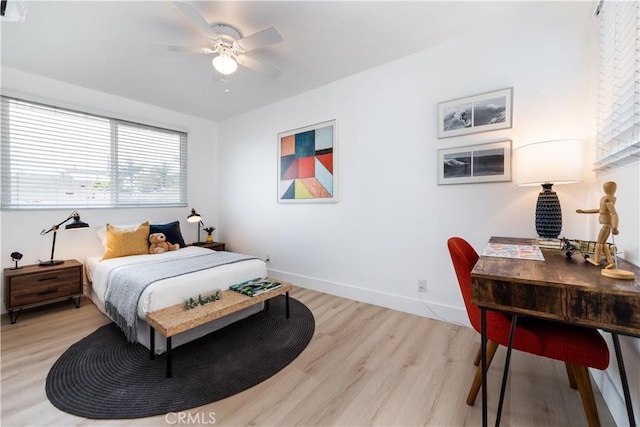 bedroom featuring ceiling fan and light wood-type flooring