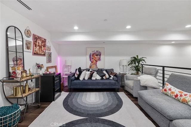 living room with dark hardwood / wood-style flooring