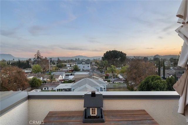 balcony at dusk with a mountain view