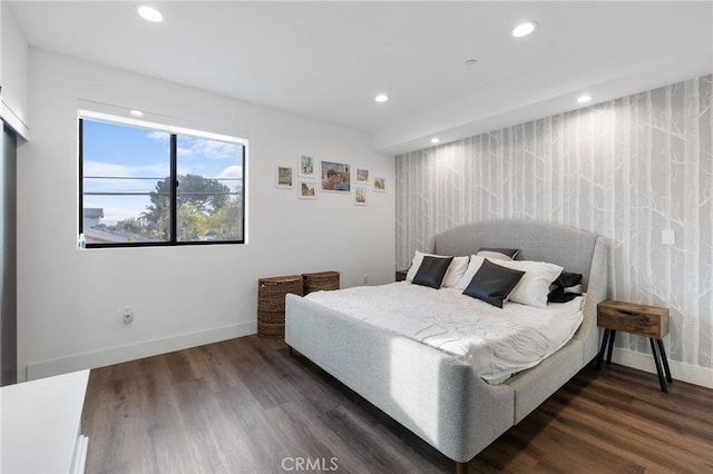 bedroom with dark wood-type flooring