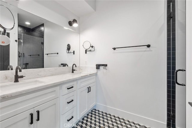 bathroom with vanity and a shower with door