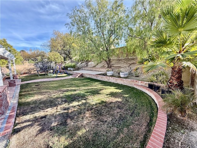 view of yard featuring a trampoline