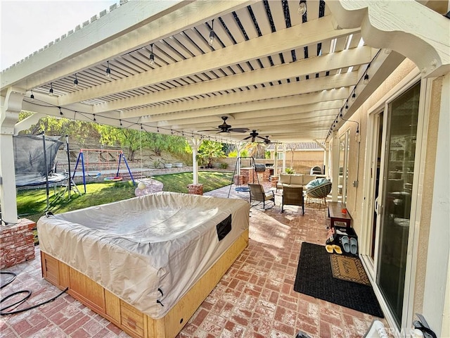 view of patio with a trampoline, outdoor lounge area, and a playground