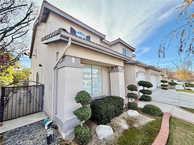 view of property exterior featuring a garage