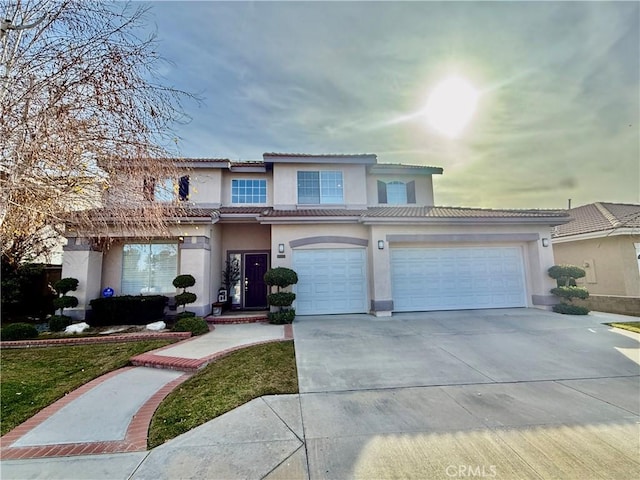 mediterranean / spanish-style home featuring a garage