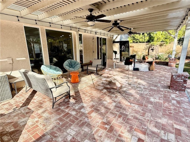 view of patio / terrace with ceiling fan, central AC, and a pergola