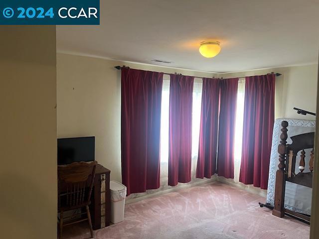 carpeted living room featuring a fireplace