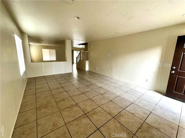 spare room with light tile patterned floors