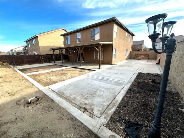 back of house featuring a patio area