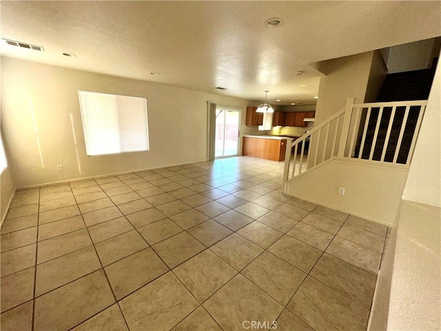 empty room featuring light tile patterned floors