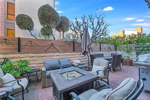 view of patio / terrace with a fire pit