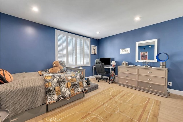 bedroom with light hardwood / wood-style floors