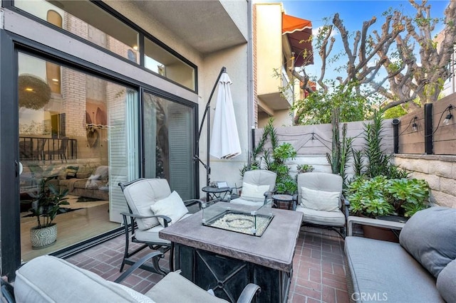 view of patio with a fire pit