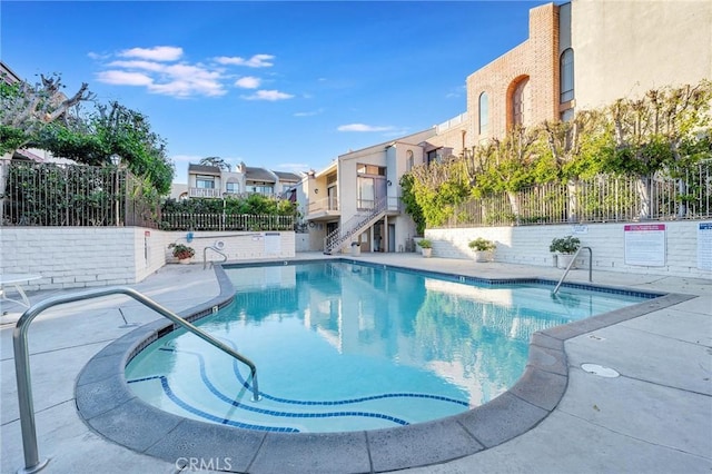 view of pool featuring a patio