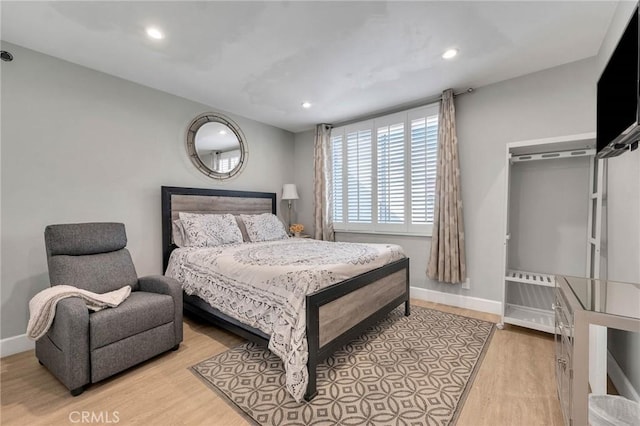 bedroom with light hardwood / wood-style floors