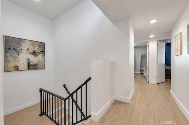 hall with light hardwood / wood-style flooring