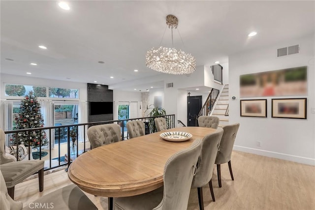 dining area featuring a notable chandelier