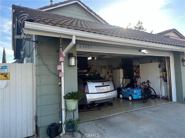 garage with white refrigerator