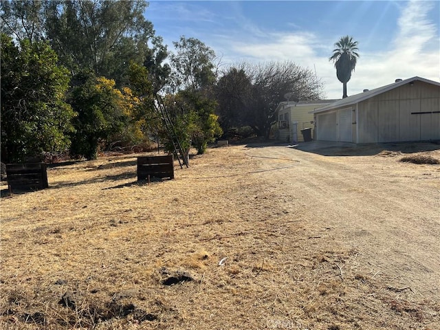 view of yard with a garage