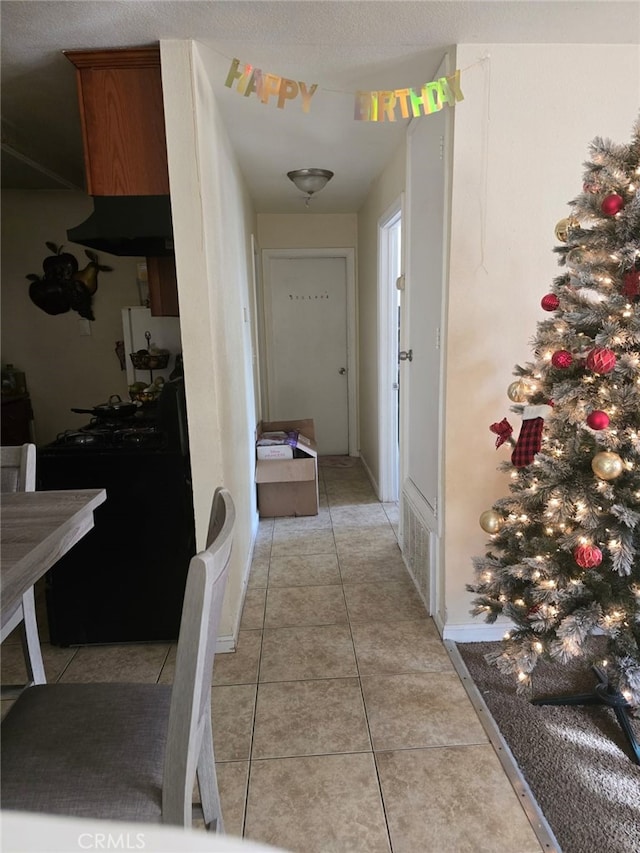 hallway with light tile patterned flooring