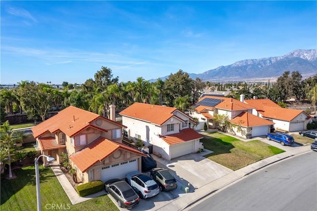 birds eye view of property featuring a mountain view