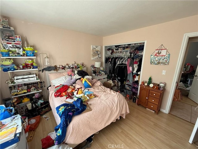 bedroom featuring a closet and light hardwood / wood-style floors