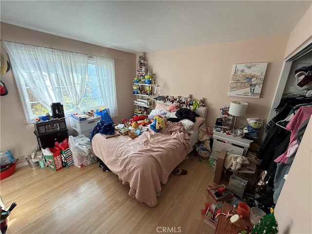 bedroom with wood-type flooring