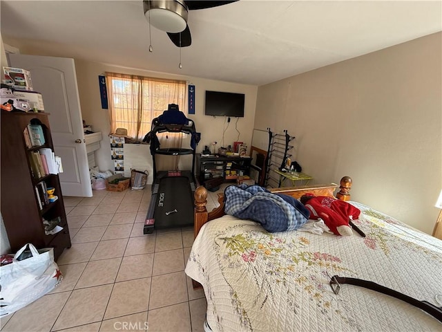 tiled bedroom with ceiling fan