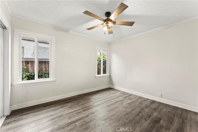 unfurnished room featuring a textured ceiling, ceiling fan, ornamental molding, and dark hardwood / wood-style floors