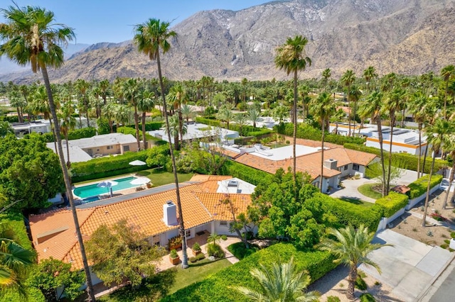 birds eye view of property with a mountain view