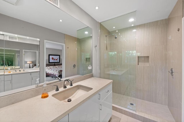 bathroom featuring vanity and a tile shower