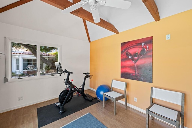 workout room featuring vaulted ceiling, ceiling fan, and wood-type flooring