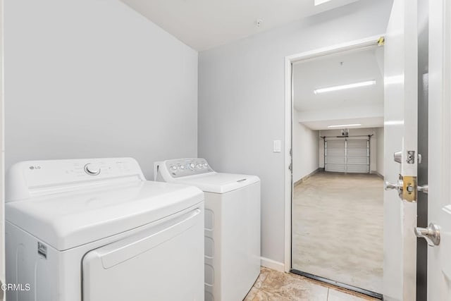 clothes washing area featuring independent washer and dryer