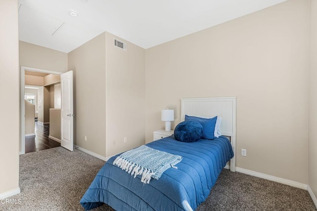 bedroom with dark carpet