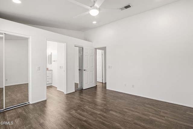 unfurnished bedroom with dark wood-type flooring, ceiling fan, and lofted ceiling