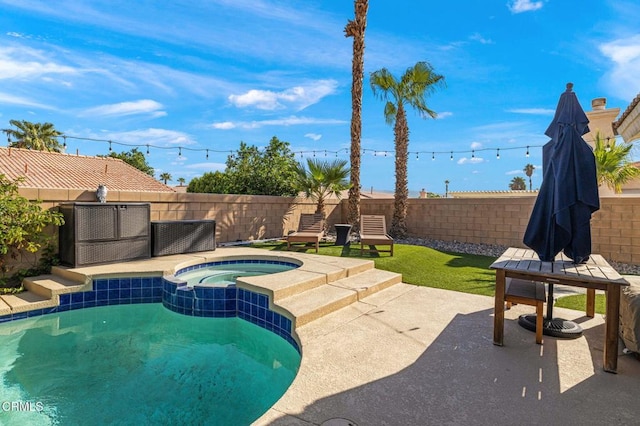 view of pool featuring a patio area and an in ground hot tub