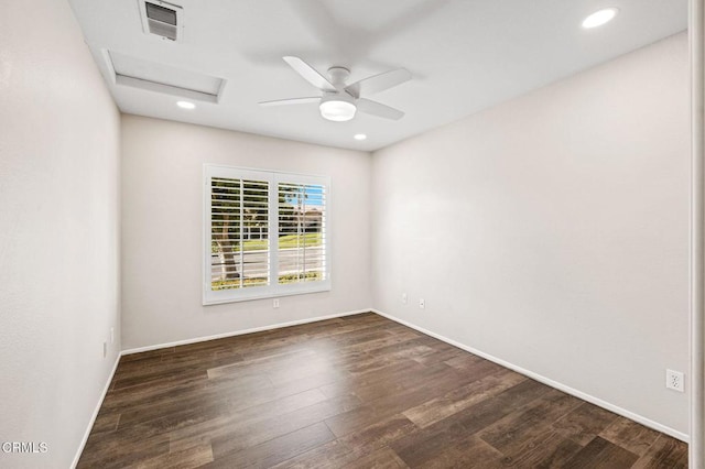 unfurnished room with ceiling fan and dark wood-type flooring