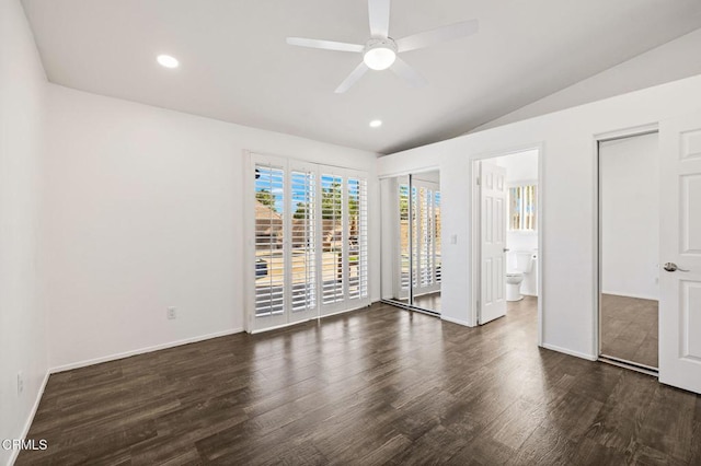 unfurnished bedroom featuring ceiling fan, lofted ceiling, access to exterior, ensuite bath, and dark wood-type flooring